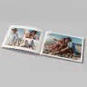 Open personalised photo book featuring a couple's beach vacation photos. The photobook has a clean, modern design with heart embellishments, making it a perfect gift idea for Valentine's Day, anniversaries, or special occasions. Ideal for creating lasting memories.