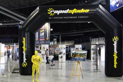 RapidStudio's stand at the Photo and Film X event, showcasing their photo books, canvas and more