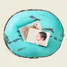 Two photo prints of a baby placed in a rustic, distressed turquoise bowl with a weathered finish. The photos feature close-up shots of a baby''s face and feet, making it a charming display for baby shower gift ideas or personalised gifts. Ideal for creating a photo album or photobook.